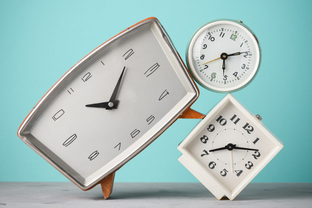 Change over time Retro alarm clocks stack time concept